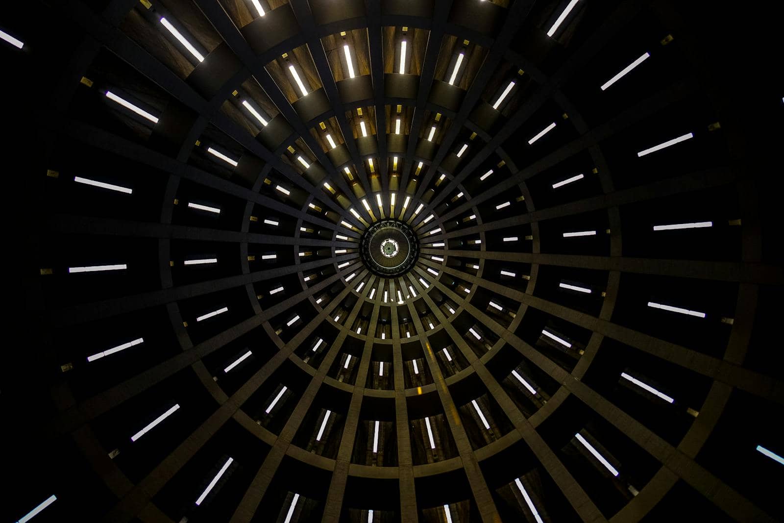 A mesmerizing abstract view of a circular dome with illuminated patterns creating a geometric design.